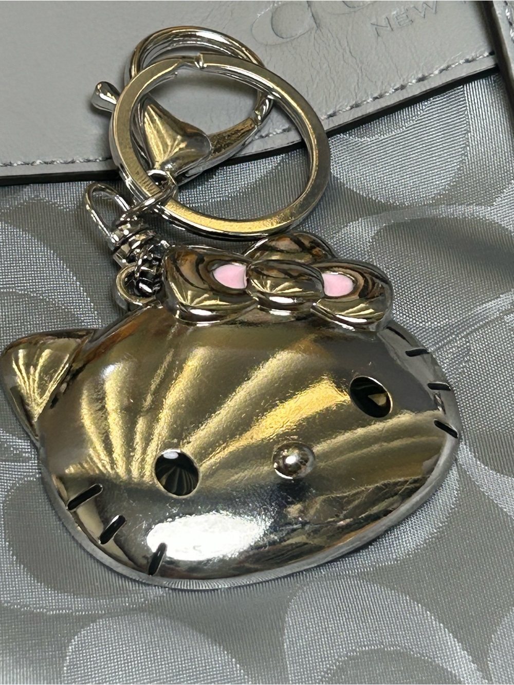 Silver Hello Kitty Keychain with Pink Bow Accent